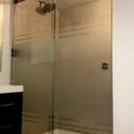 Sliding shower enclosure